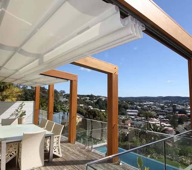 Balcony with automated retracting awning system